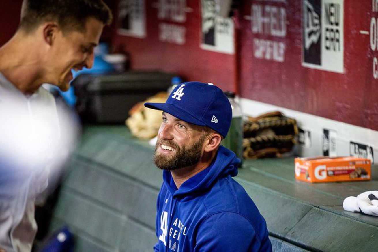Danny Duffy joins his new Dodgers teammates in the dugout at Chase Field in Arizona on August 1, 2021, three days after the Dodgers acquired the left-handed pitcher from the Royals before the MLB trade deadline.