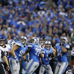 The Detroit Lions defensive line and the Baltimore Ravens look towards the end zone after Ravens kicker Justin Tucker, far right, kicked a 61-yard field goal to lead the game during the fourth quarter of an NFL football game in Detroit, Monday, Dec. 16, 2013. 