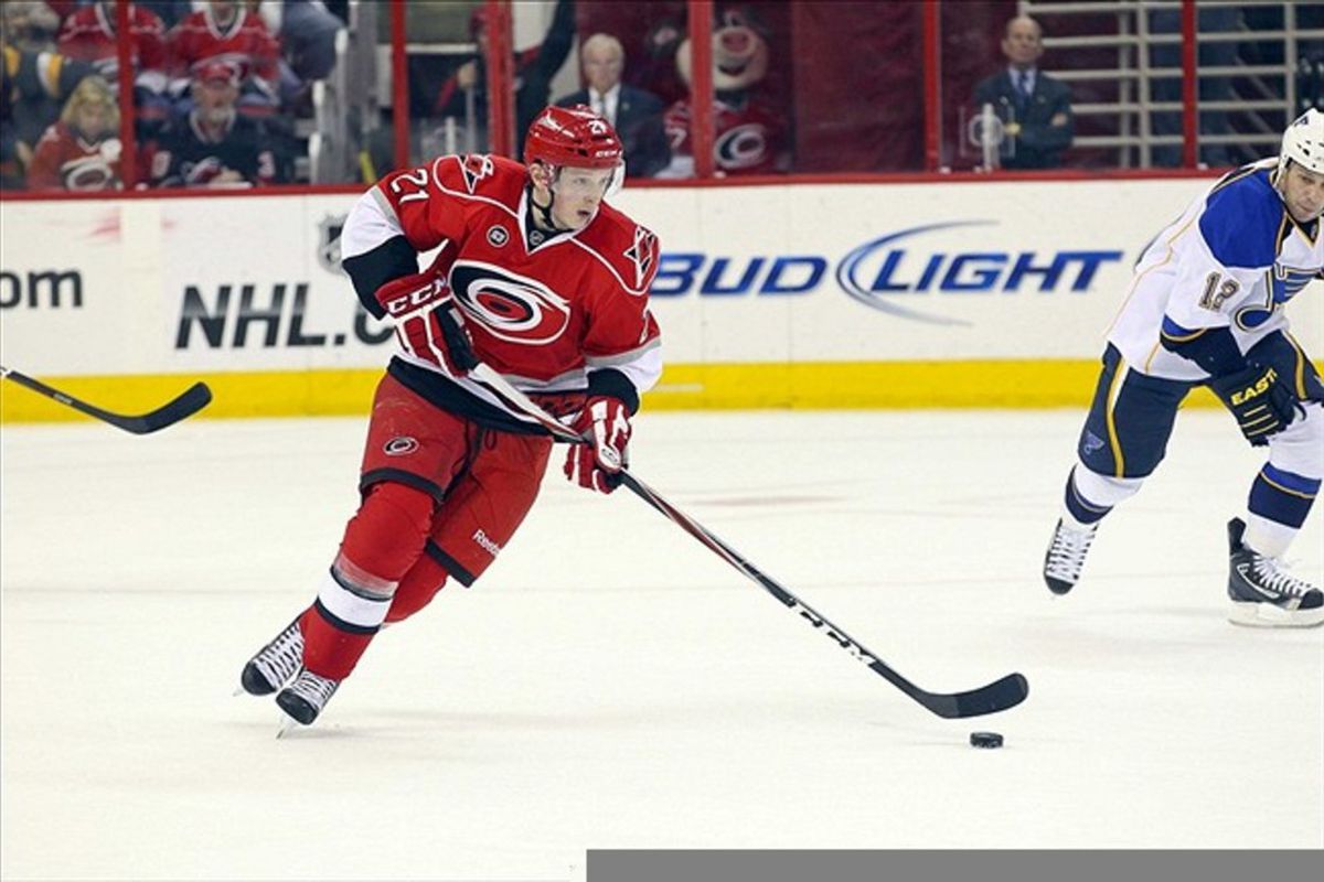 March 15, 2012; Raleigh, NC, USA; Carolina Hurricanes left wing Drayson Bowman (21) carries the puck against the St. Louis Blues at the PNC center. The Hurricanes defeated the Blues 2-0. Mandatory Credit: James Guillory-US PRESSWIRE