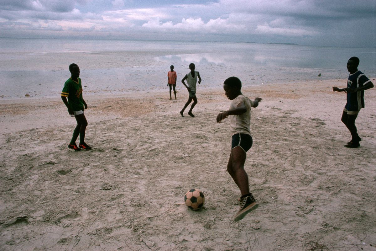 Tanzanian Boys Playing Soccer on Beach