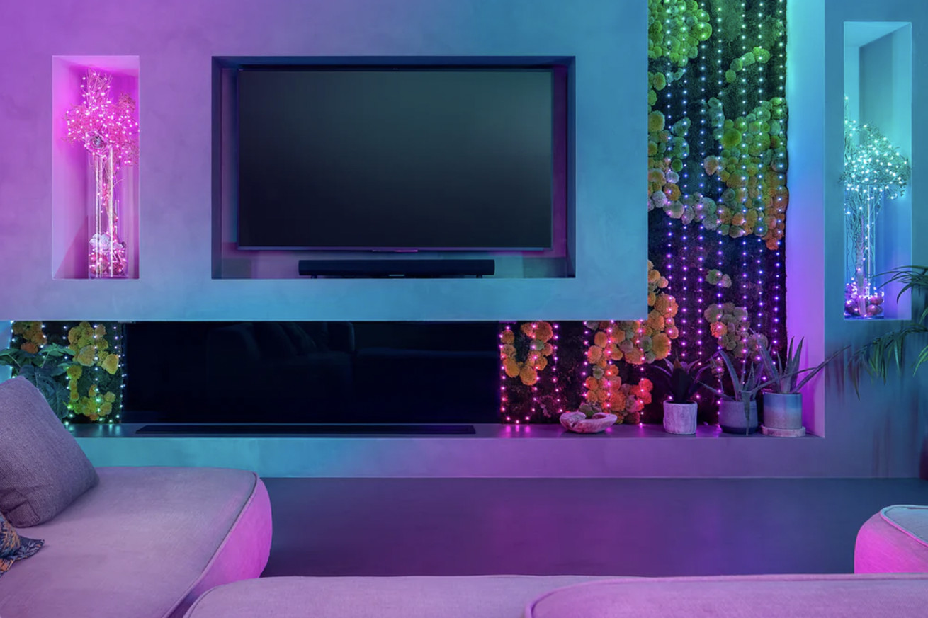 Twinkly Candies strung up behind a TV radiating colorful lights
