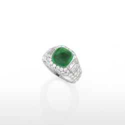  Bulgari's Italian Estate platinum ring centering on a sugarloaf cabochon emerald surrounded by 74 round-cut diamonds and 4 baguette diamonds. $95,000