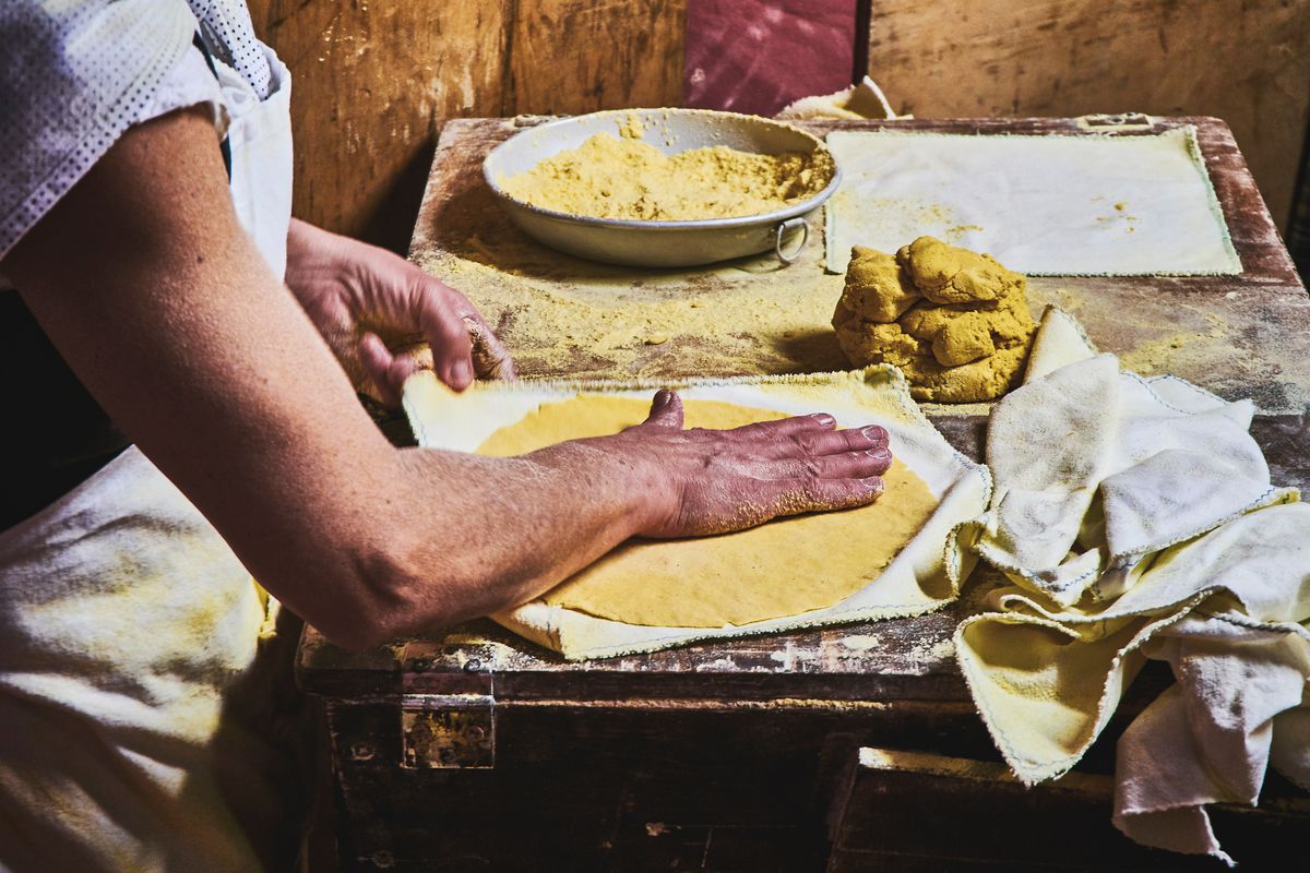 A person making a tortilla