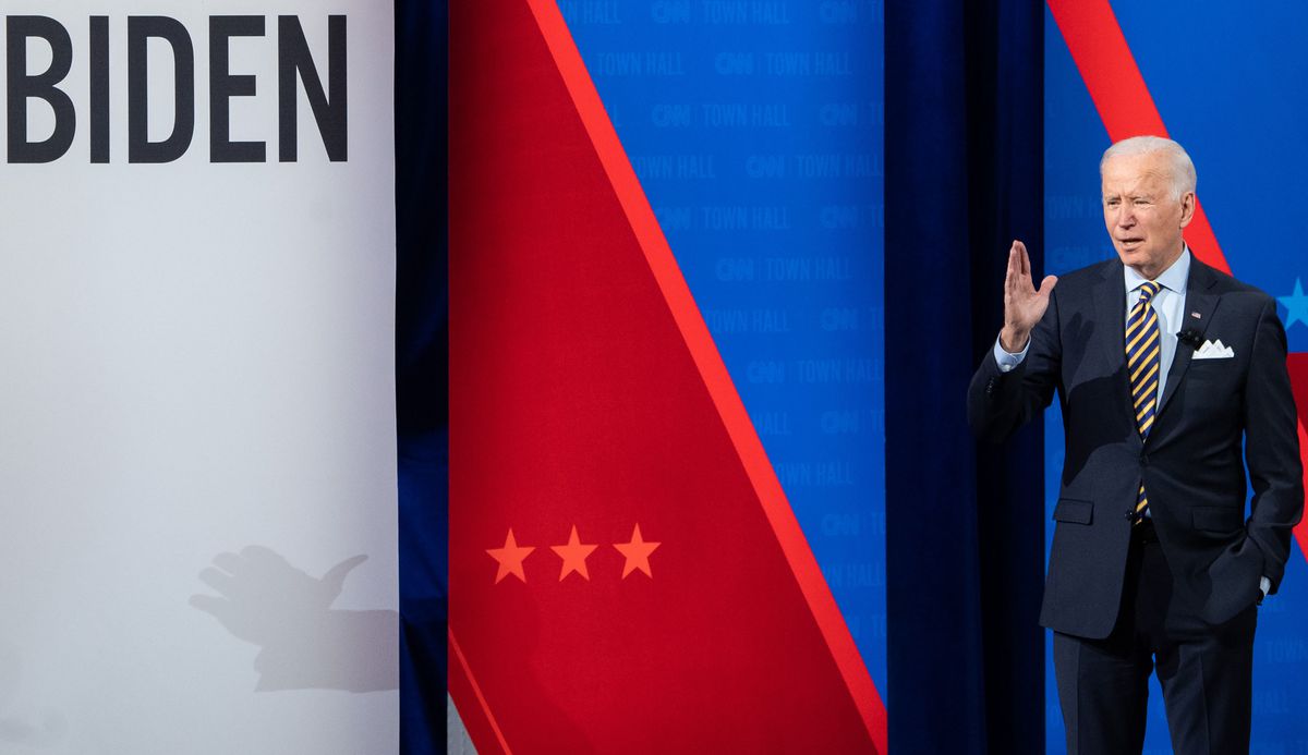President Joe Biden stands on a stage in Milwaukee, Wisconsin