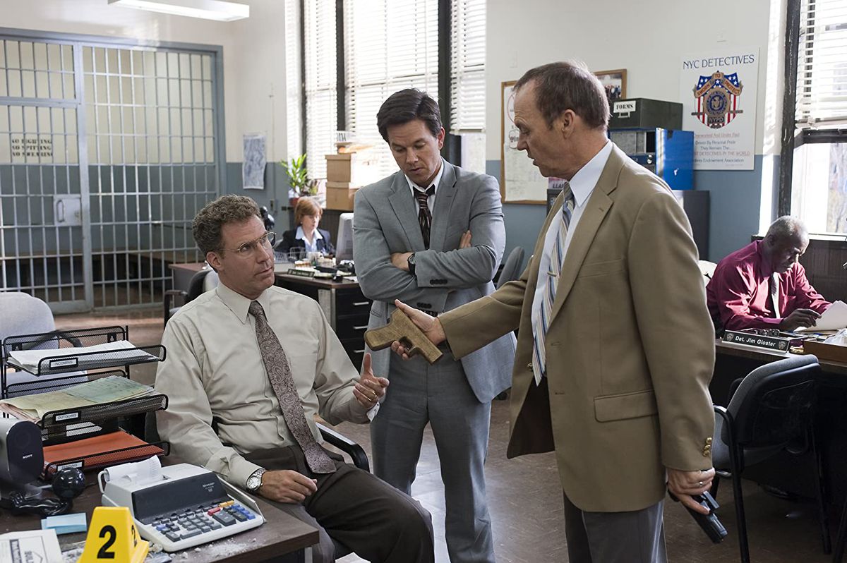 Will Ferrell (seated) Mark Walberg and Michael Keaton in a screenshot from The Other Guys