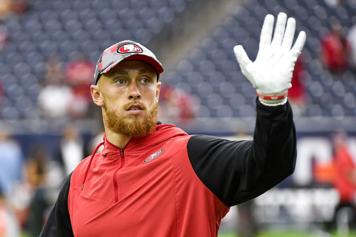 George Kittle #85 of the San Francisco 49ers acknowledges fans prior to the preseason game at NRG Stadium against the Houston Texans on August 25, 2022 in Houston, Texas.
