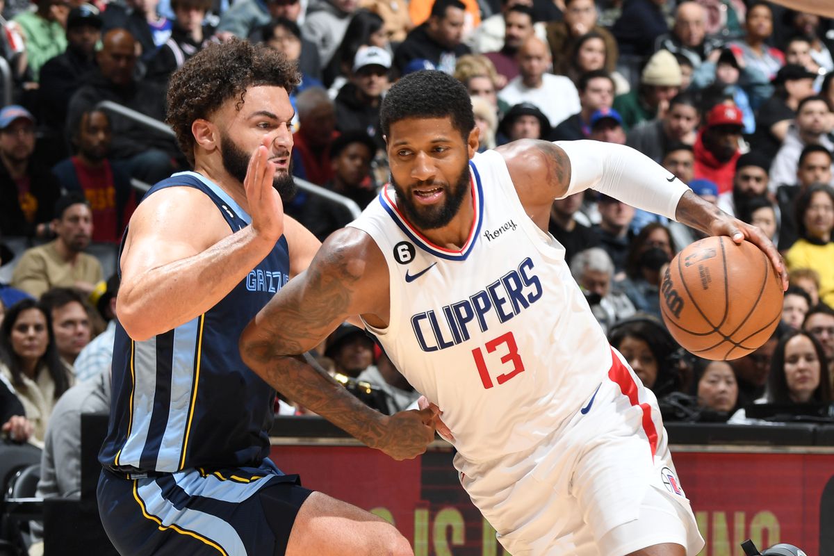 Paul George #13 of the LA Clippers moves the ball during the game against the Memphis Grizzlies on March 5, 2023 at Crypto.Com Arena in Los Angeles, California.