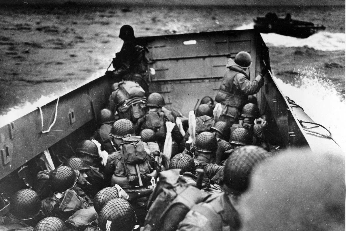 In this June 6, 2014 file photo, allied troops crouch behind the bulwarks of a landing craft as it nears Omaha Beach during a landing in Normandy, France. The D-Day invasion broke through Adolf Hitler"™s western defenses and led to the liberation of Franc