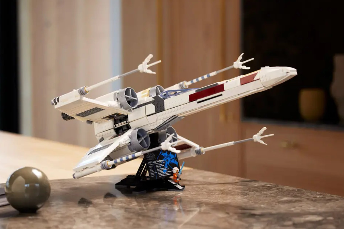 A stock photo of the 2023 Lego X-Wing model assembled on a kitchen counter.