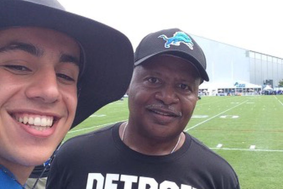 Pride of Detroit staffer Hamza Baccouche poses for a picture with then-Lions head coach Jim Caldwell during training camp in 2017. 