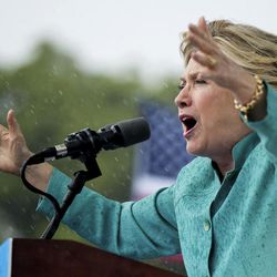 Democratic presidential candidate Hillary Clinton speaks during a heavy rain at a rally at C.B. Smith Park in Pembroke Pines, Fla., Saturday, Nov. 5, 2016. 