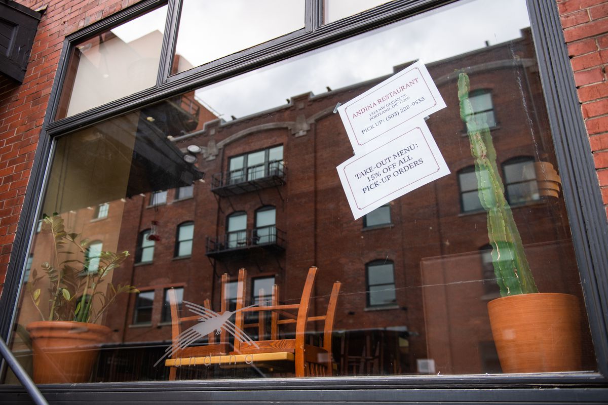 The wooden chairs of this Pearl District Peruvian restaurant sit on the tables, closed to customers for weeks. On the windows, two white signs advertise takeout and delivery orders.