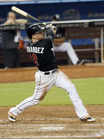 Miami Marlins’ Enrique Hernandez hits a triple against the Philadelphia Phillies during the fifth inning (2014)
