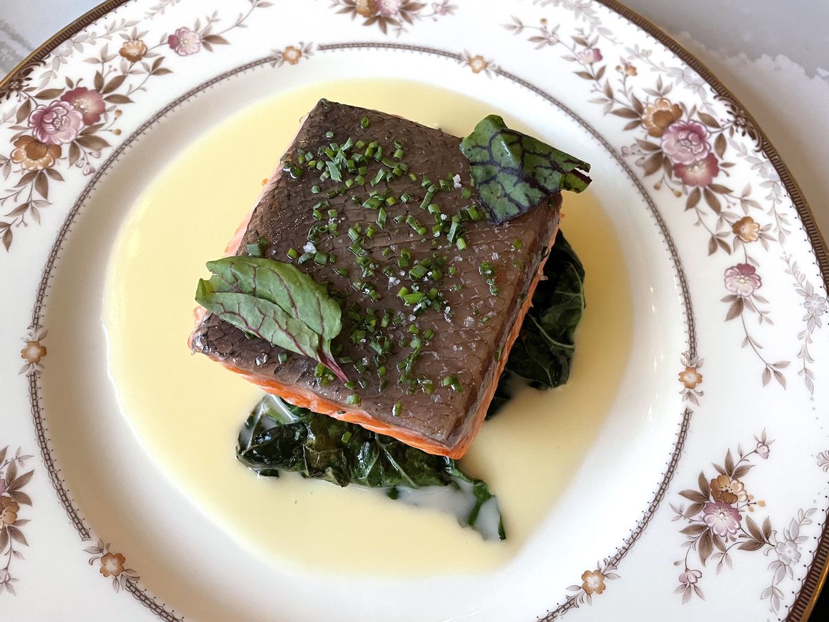 Steamed ocean trout in beurre blanc with kale and sorrel.