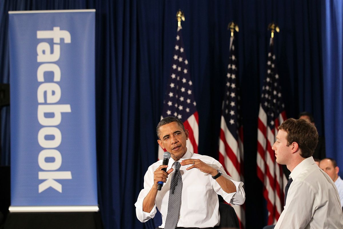 Mark Zuckerberg and Barack Obama holding a town hall in 2011.
