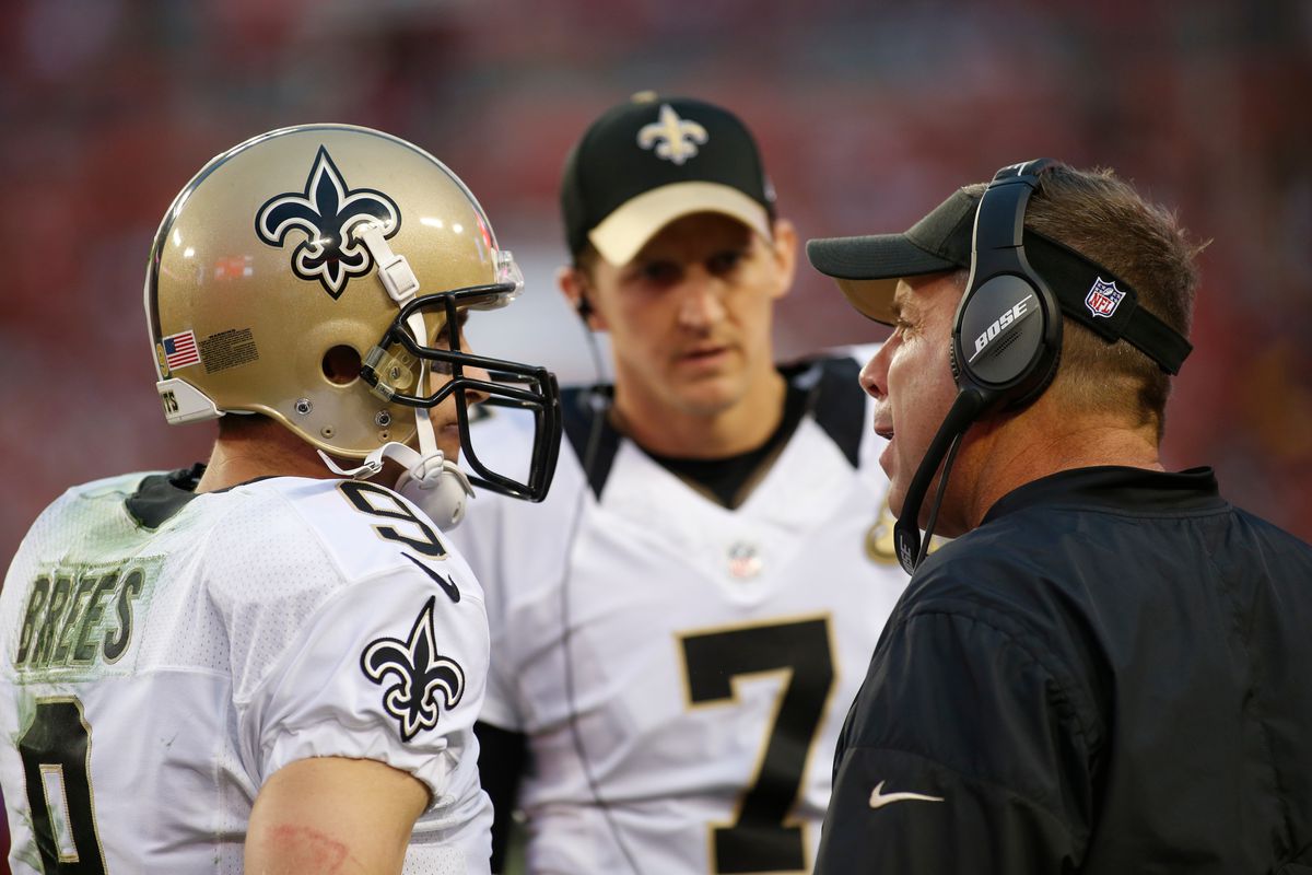 TAMPA, FL - New Orleans Saints head coach Sean Payton speaks with quarterbacks Drew Brees (9) and Luke McCown (7) during a game against the Tampa Bay Buccaneers at Raymond James Stadium.