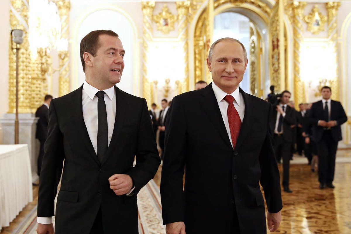 Russian Prime Minister Dmitry Medvedev, left, and President Vladimir Putin walk after the president delivered his annual state of the nation address in the Kremlin in Moscow, Russia, Thursday, Dec. 1, 2016.