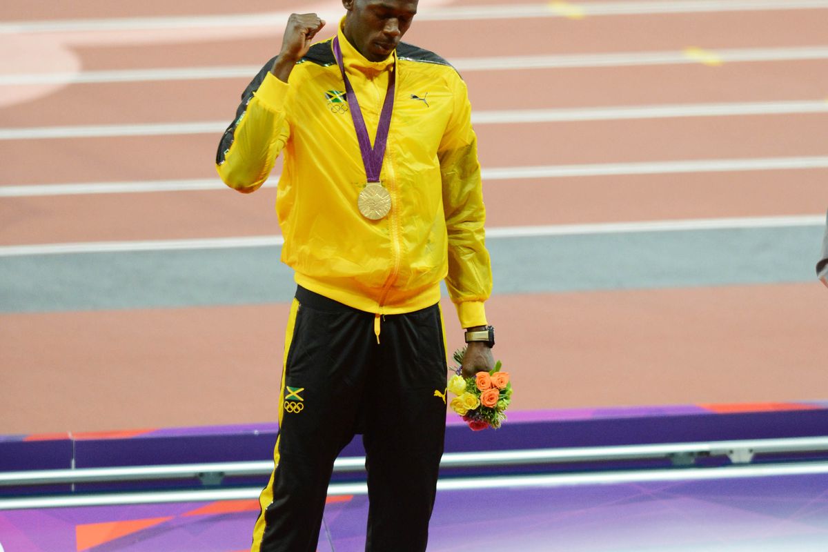 Aug 6, 2012; London, United Kingdom; Usain Bolt (JAM) reacts after receiving the gold medal during the 100m men's victory ceremony during the London 2012 Olympic Games at Olympic Stadium.