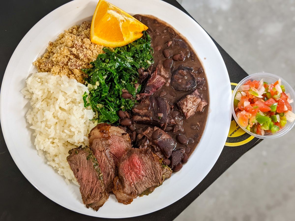 Feijoada, picanha, and a full plate of Brazilian food at Sexy Beans.