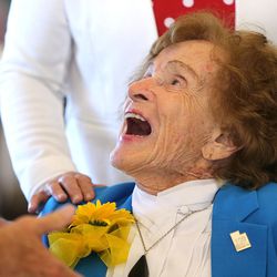 Mary Bee Jensen smiles up at the governor during the 31st Centenarian Celebration at the Viridian Event Center in West Jordan on Thursday, Aug. 17, 2017.