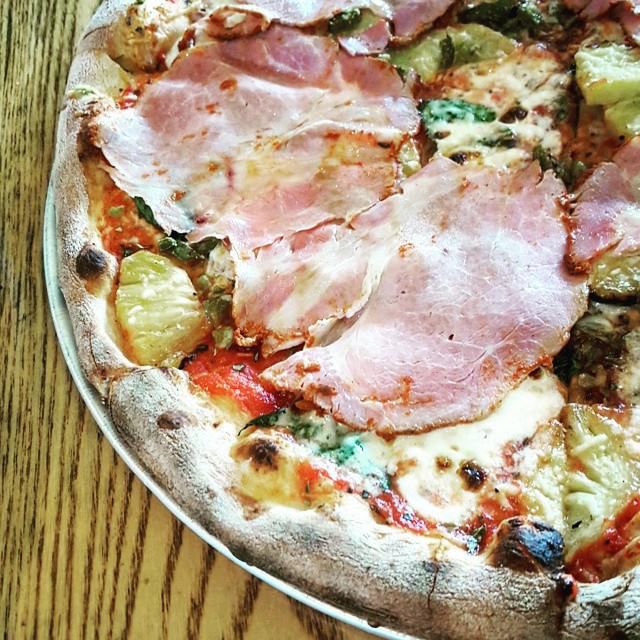 Pineapple, capicola, and jalapeno pizza at When Pigs Fly