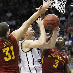 BYU's Tyler Haws is fouled by Georges Niang and Melvin Ejim as BYU and Iowa State play Wednesday, Nov. 20, 2013 in the Marriott Center in Provo. Iowa State won 90-88.