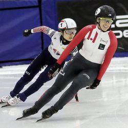 First place finisher Marianne St-Gelais, right, of Canada, reacts after crossing the finish line, followed by second place finisher Choi Minjeong following the women\'s 500 meters final at a World Cup short track speedskating event at the Utah Olympic Oval, Sunday, Nov. 13, 2016, in Kearns, Utah. (AP Photo/Rick Bowmer)
