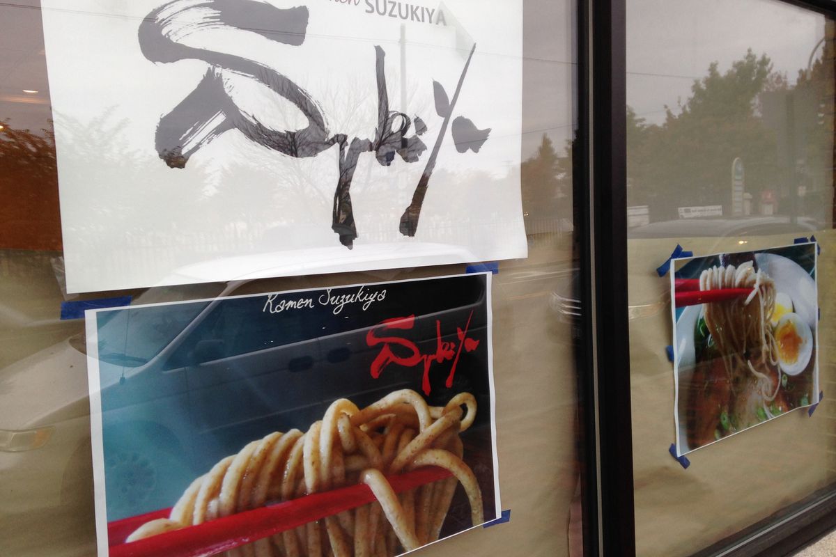 Exterior of 229 Congress Street, Portland, with photos of Ramen Suzukiya dishes in the windows.