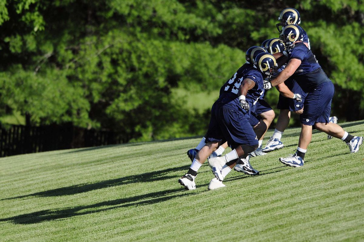 June 12, 2012; St. Louis, MO, USA; St. Louis Rams offensive line runs drills during training camp at ContinuityX Training Center. Mandatory Credit: Jeff Curry-US PRESSWIRE