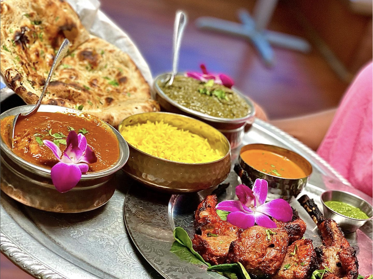 A number of Indian dishes on a platter.