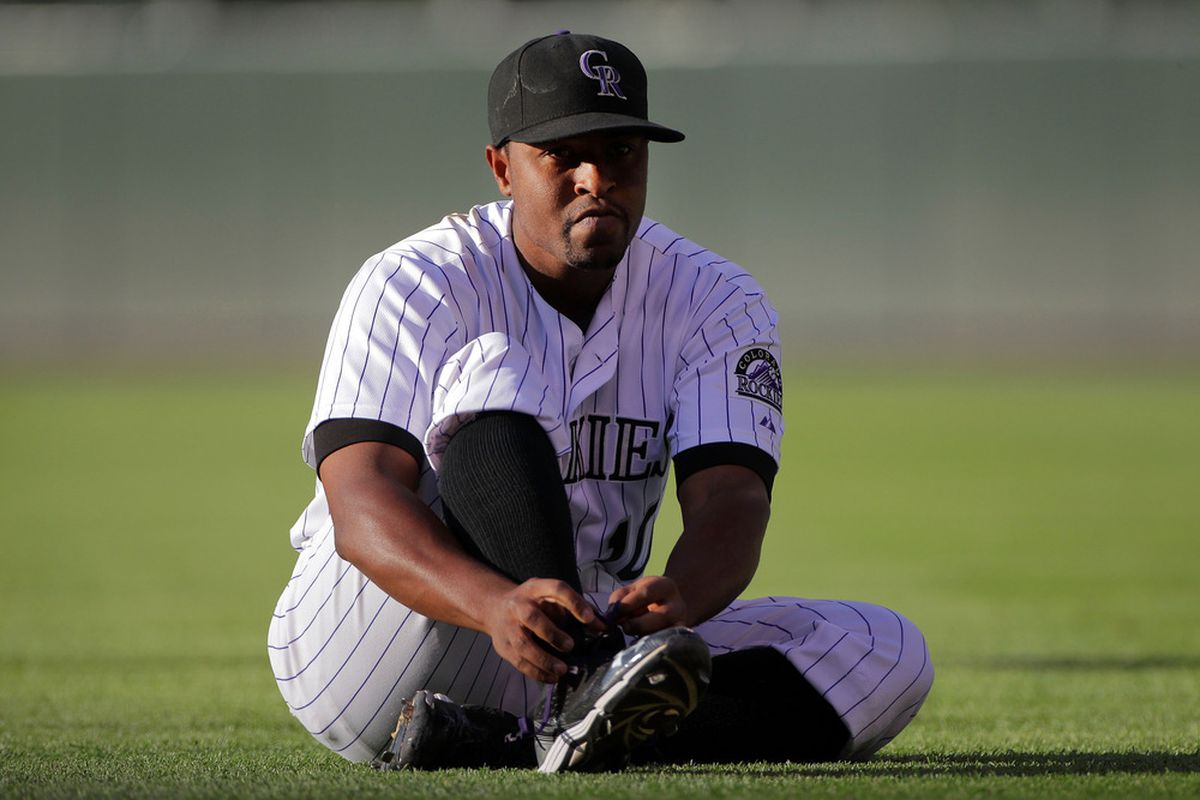 DENVER, CO - AUGUST 17:  Chris Nelson #10 of the Colorado Rockies ties his shoes before playing against the Florida Marlins at Coors Field on August 17, 2011 in Denver, Colorado.  (Photo by Doug Pensinger/Getty Images)