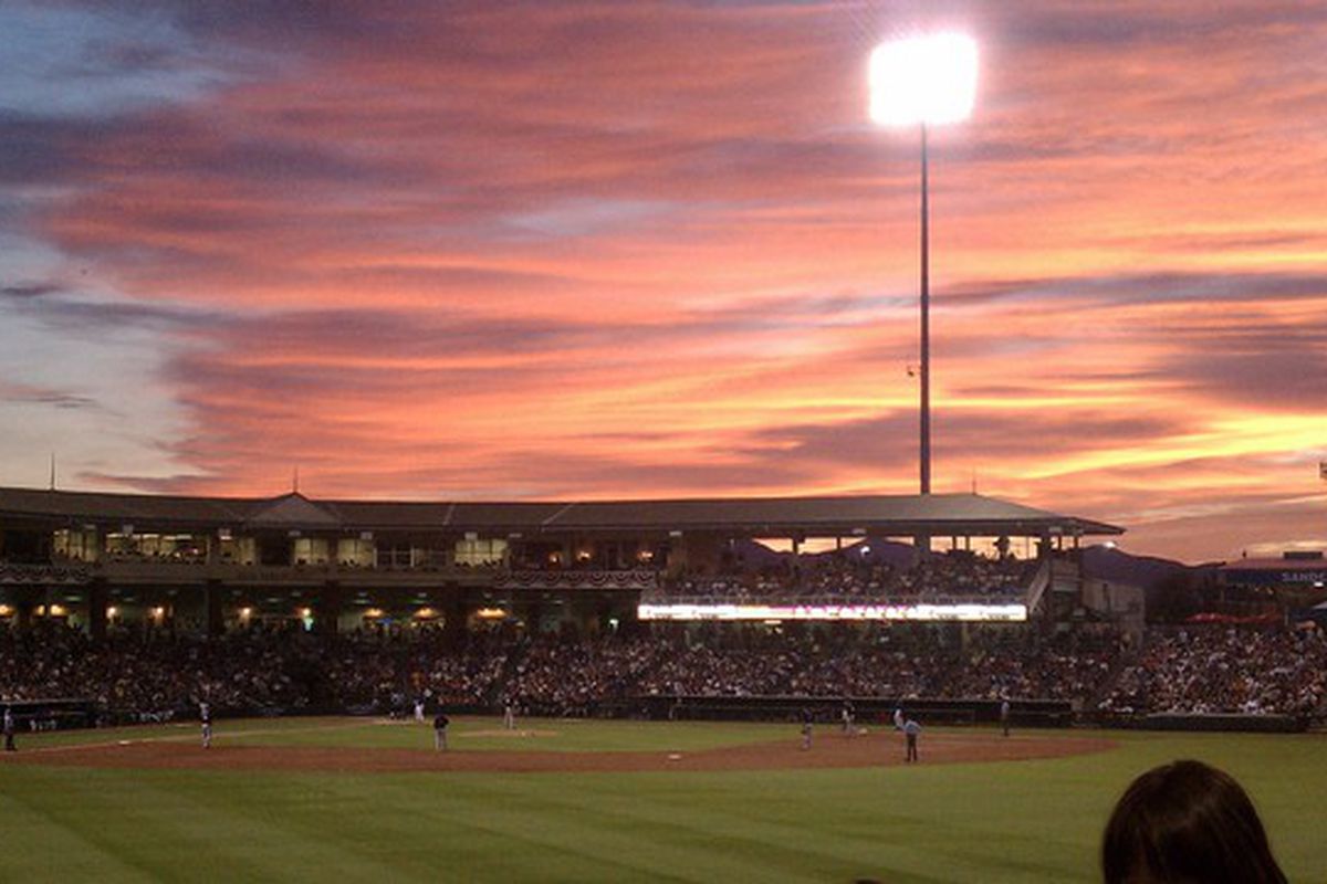 The Rockies beat the Rangers 11-10 on March 16, 2011 in Surprise, Arizona.  Craig Baker earned the save in that game.