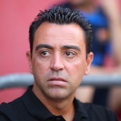 Xavi watches on from the sidelines