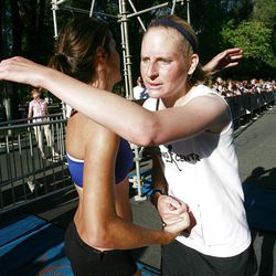 Allie Scott, right, last year's winner, hugs 2010 winner Jenn Shelton after completing the Deseret News Marathon Saturday.