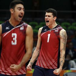 United States' Taylor Sander (3) and Matthew Anderson (1) celebrate during a men's bronze medal volleyball match against Russia at the 2016 Summer Olympics in Rio de Janeiro, Brazil, Sunday, Aug. 21, 2016.