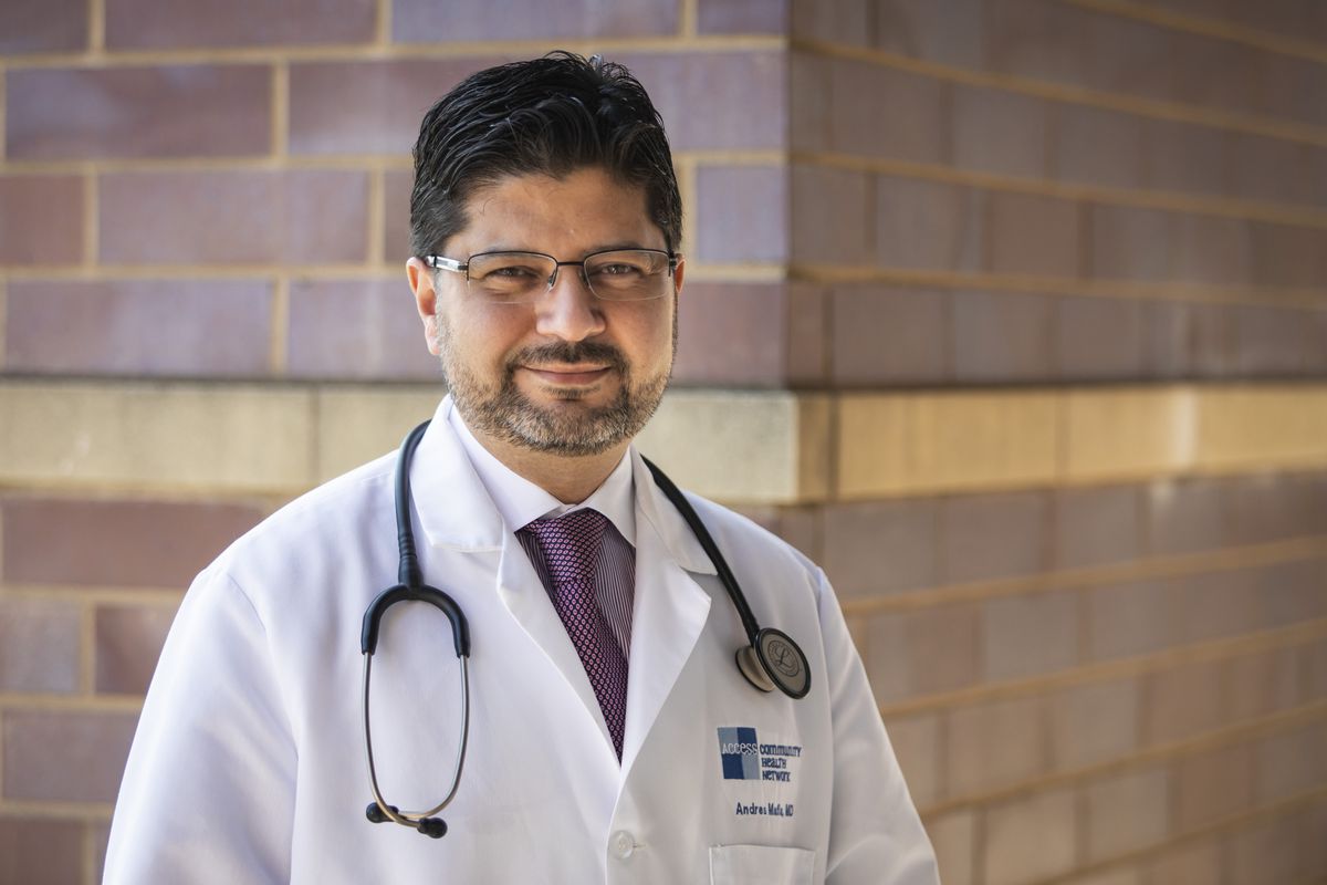 Dr. Andres Malfa poses for a portrait outside Access Hawthorne Family Health Center, 3040 S. Cicero Ave. in Cicero, Wednesday morning, March 25, 2020.