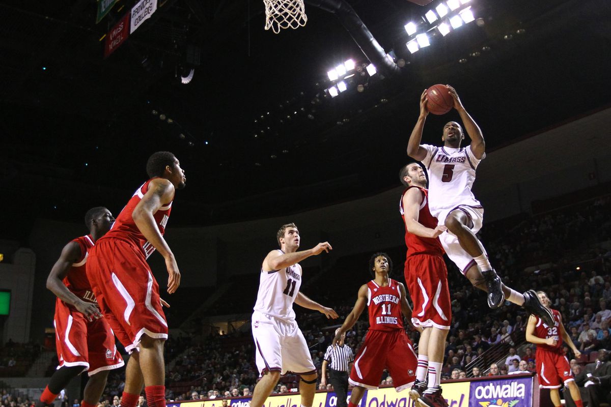 Clyde Santee (right) soars in for two of his 13 points on Saturday.
