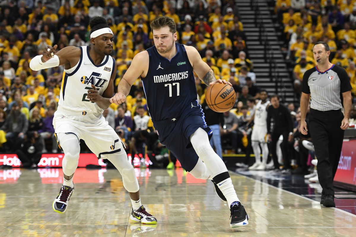 Luka Doncic #77 of the Dallas Mavericks drives past Danuel House Jr. #25 of the Utah Jazz during the first half of Game Four of the Western Conference First Round Playoffs at Vivint Smart Home Arena on April 23, 2022 in Salt Lake City, Utah.