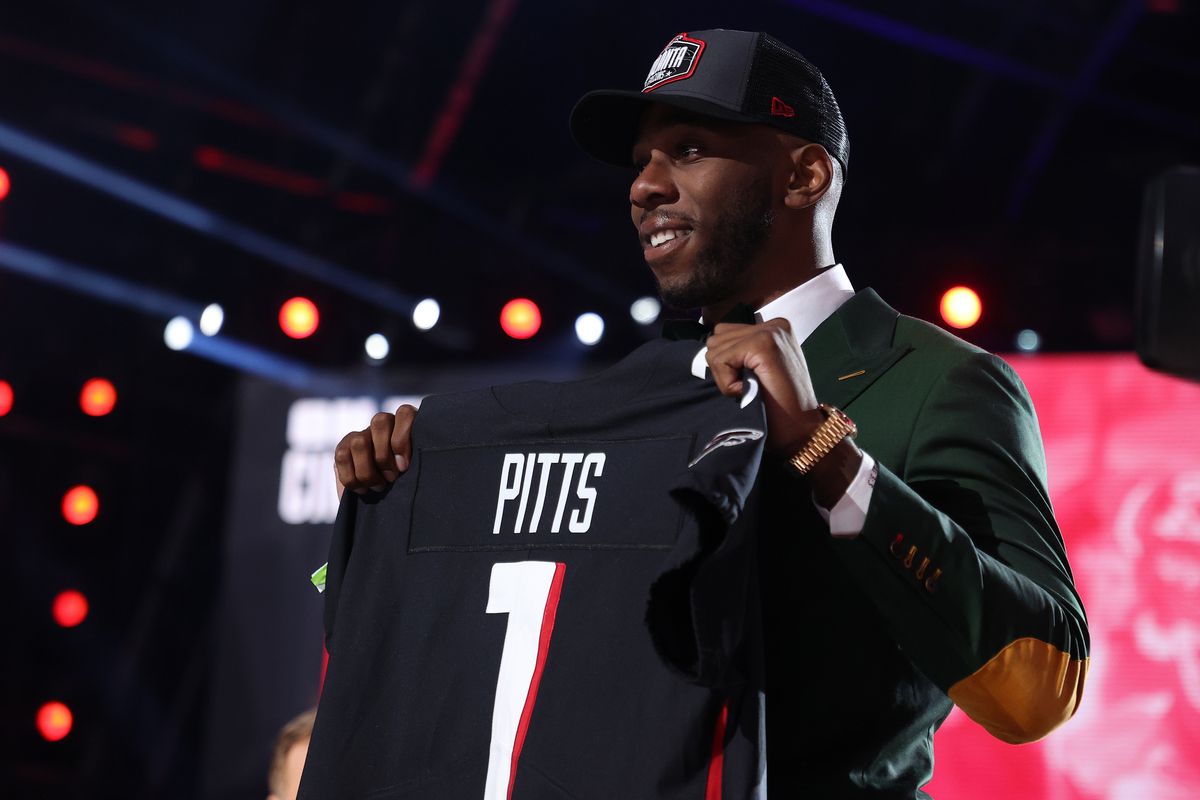 Kyle Pitts poses onstage after being selected fourth by the Atlanta Falcons during round one of the 2021 NFL Draft at the Great Lakes Science Center on April 29, 2021 in Cleveland, Ohio.