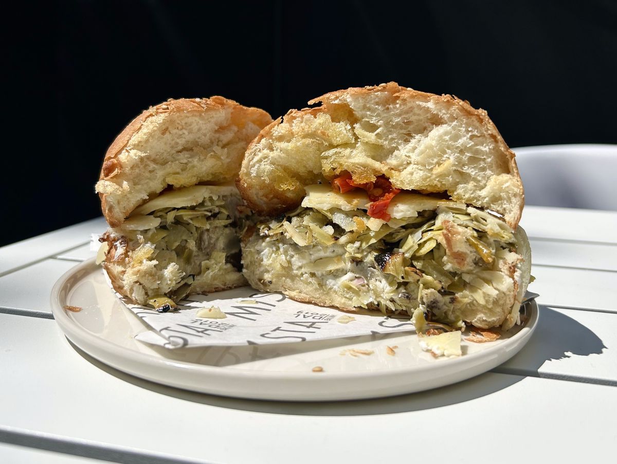 A cross-section of a sandwich with grilled artichoke, hot peppers, and provolone.