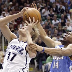 Jazz forward Andrei Kirilenko is fouled by Denver guard Joey Graham during NBA action at EnergySolutions Arena in Salt Lake City on Saturday. The Jazz won, 116-106.