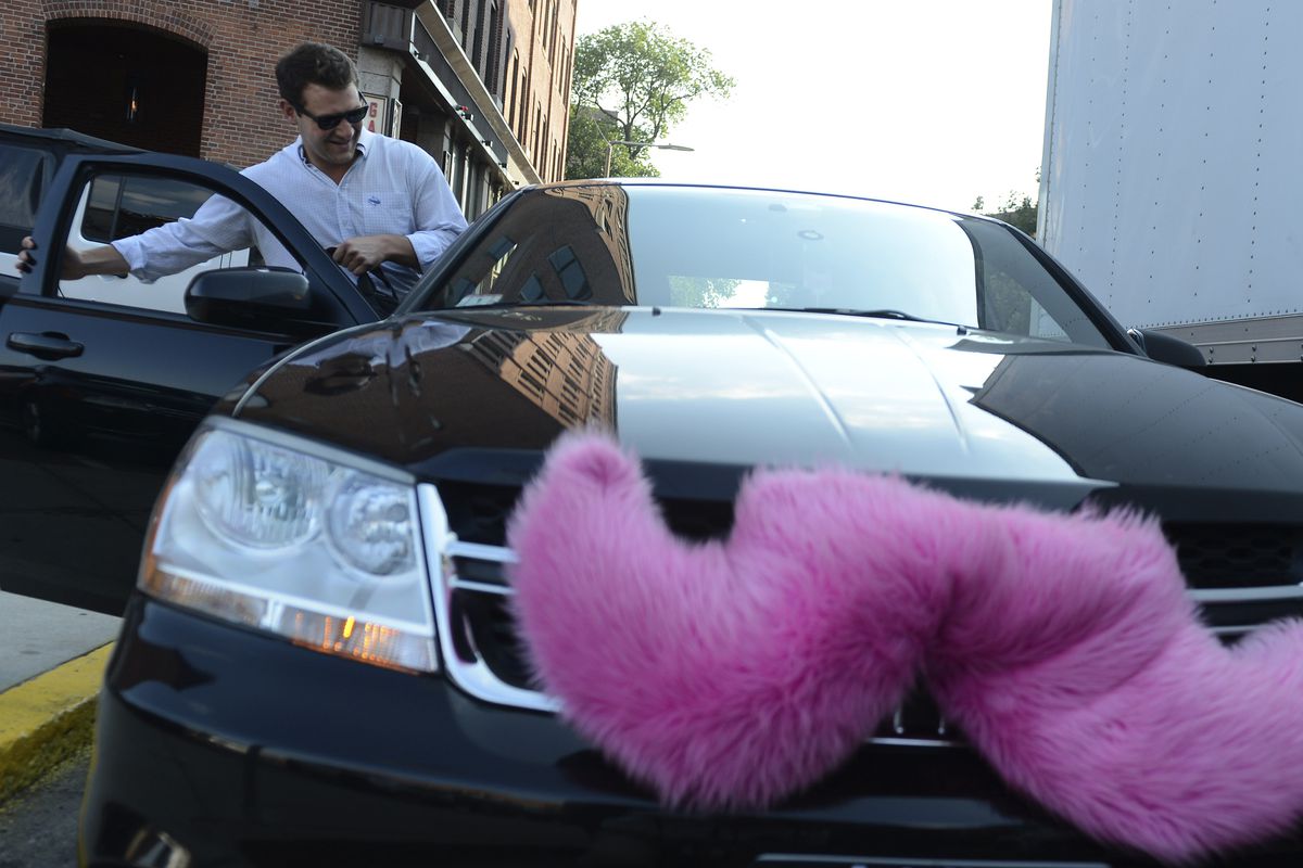 A Lyft car with its iconic mustache
