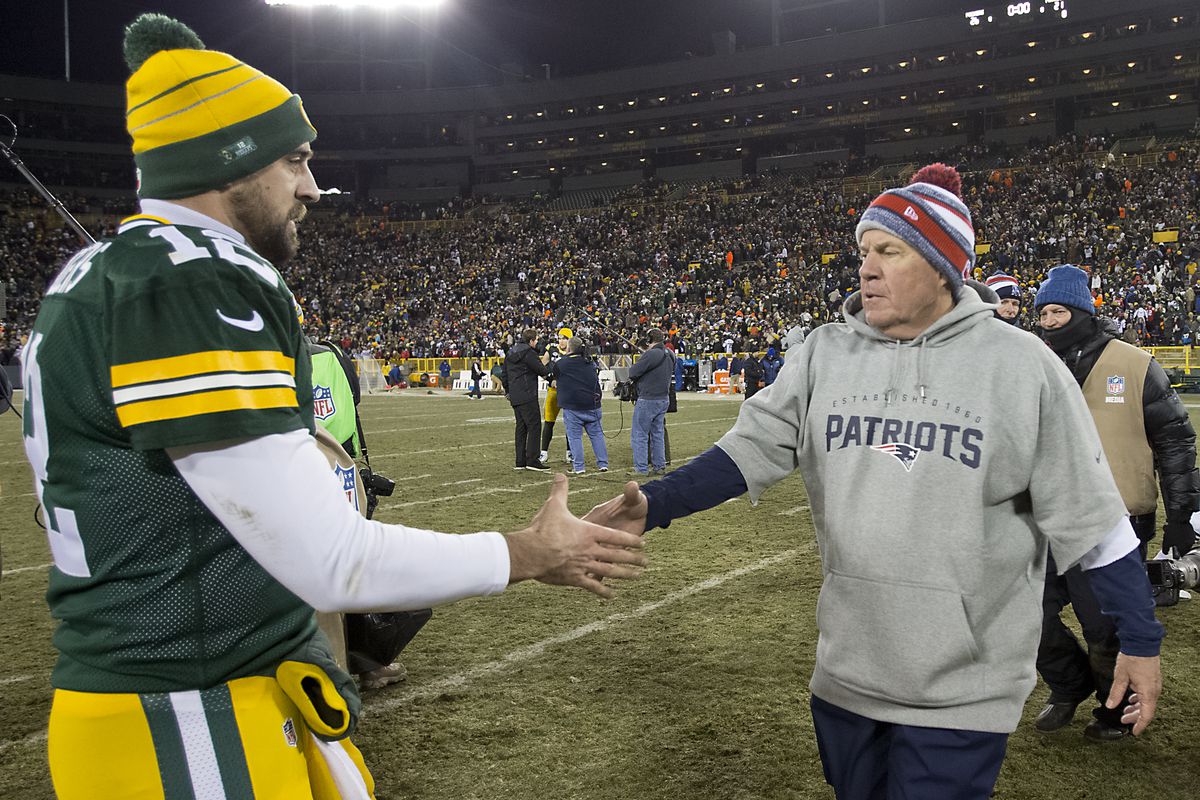 New England Patriots head coach Bill Belichick shakes hands with Green Bay Packers quarterback Aaron Rodgers after the Packers defeated the Patriots 26-21 at Lambeau Field on November 30, 2014.