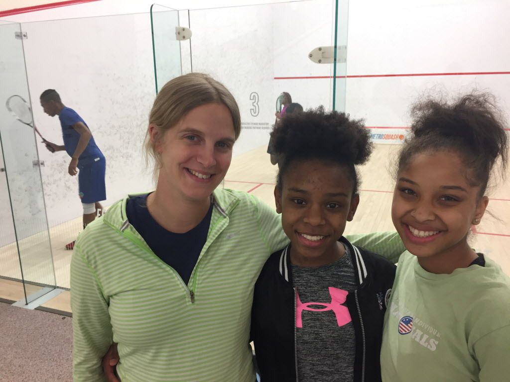Emma Charlton (left) was a world-ranked professional squash player from England before joining MetroSquash, an afterschool program for South Side youth combining academics and competitive squash. Here’s she’s with MetroSquash participants Issys Griffin, 1