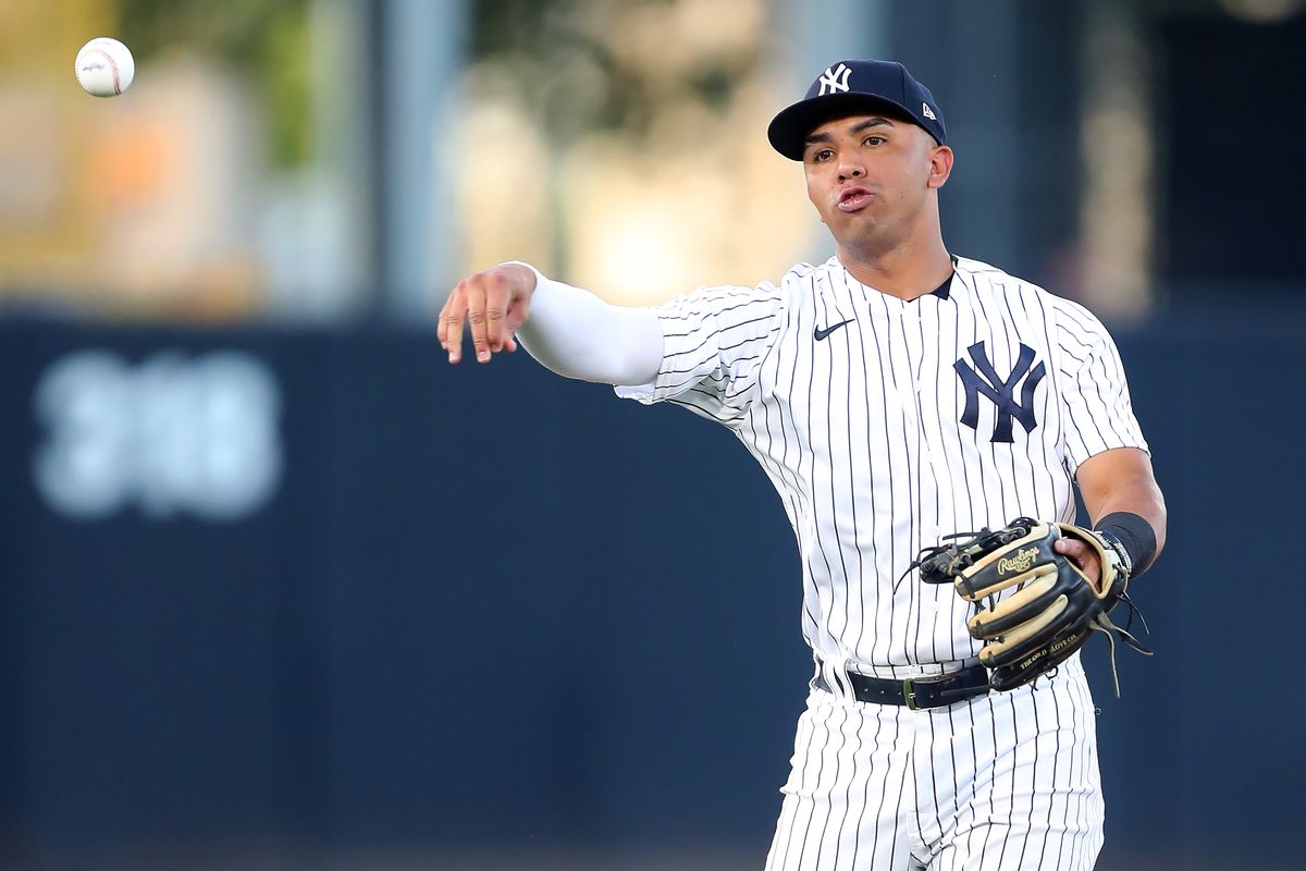 New York Yankees Infielder Oswald Peraza throws the ball over to first base during the spring training game between the Pittsburgh Pirates and the New York Yankees on March 16, 2023 at George M. Steinbrenner Field in Tampa, FL.