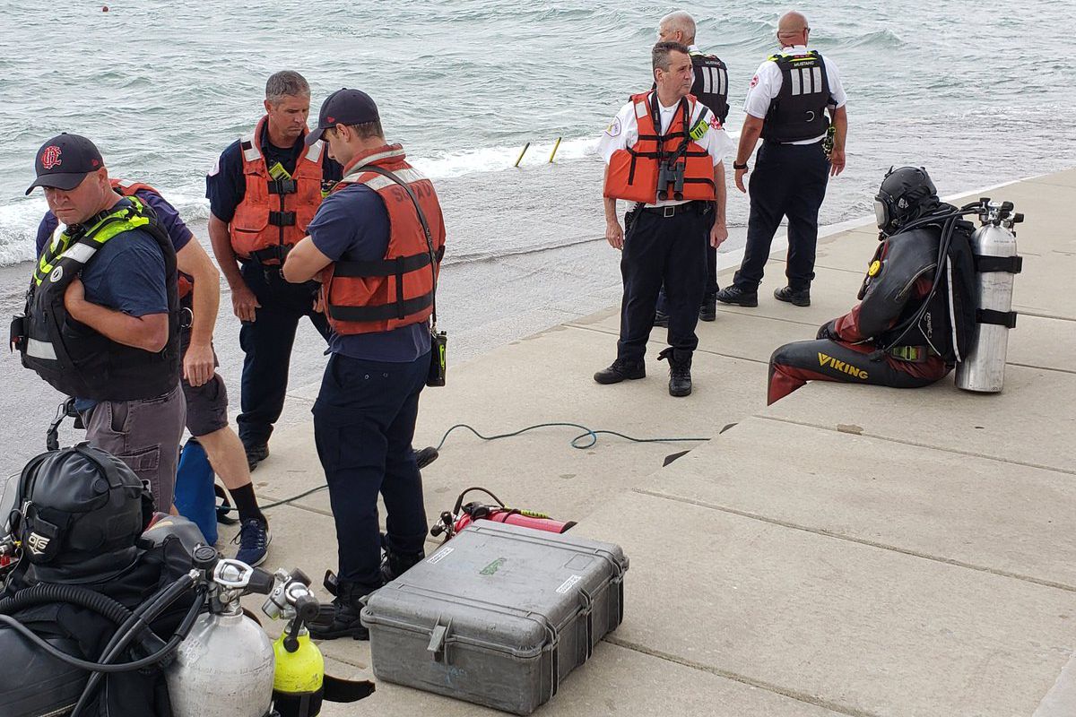 Divers searched for a teen boy who fell into Lake Michigan August 3, 2020, at Diversey Harbor.
