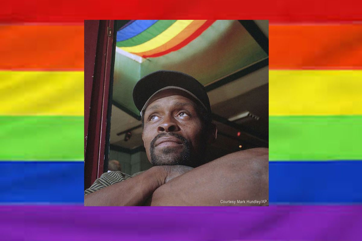 Photo of Glenn Burke on a rainbow background