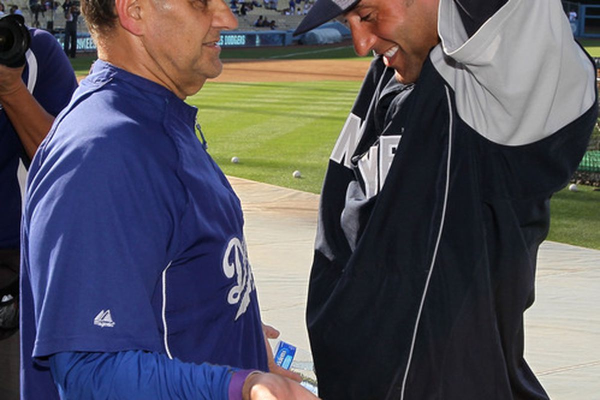 LOS ANGELES, CA - JUNE 25:  Derek Jeter #2 of the New York Yankees greets manager Joe Torre of the Los Angeles Dodgers before their game on June 25, 2010 at Dodger Stadium in Los Angeles, California.  (Photo by Stephen Dunn/Getty Images)