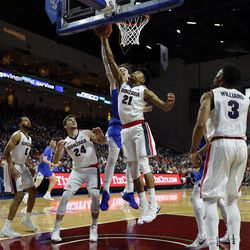 Brigham Young Cougars forward Payton Dastrup defends as Gonzaga Bulldogs forward Rui Hachimura goes up for a shot during the West Coast Conference basketball championship game in Las Vegas on Tuesday, March 6, 2018.