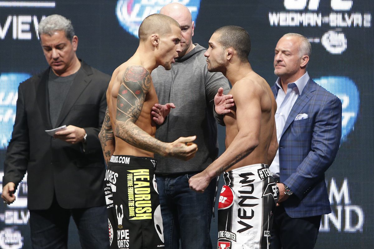 Dustin Poirier yells at Diego Brandao at the UFC 168 weigh-ins Friday.